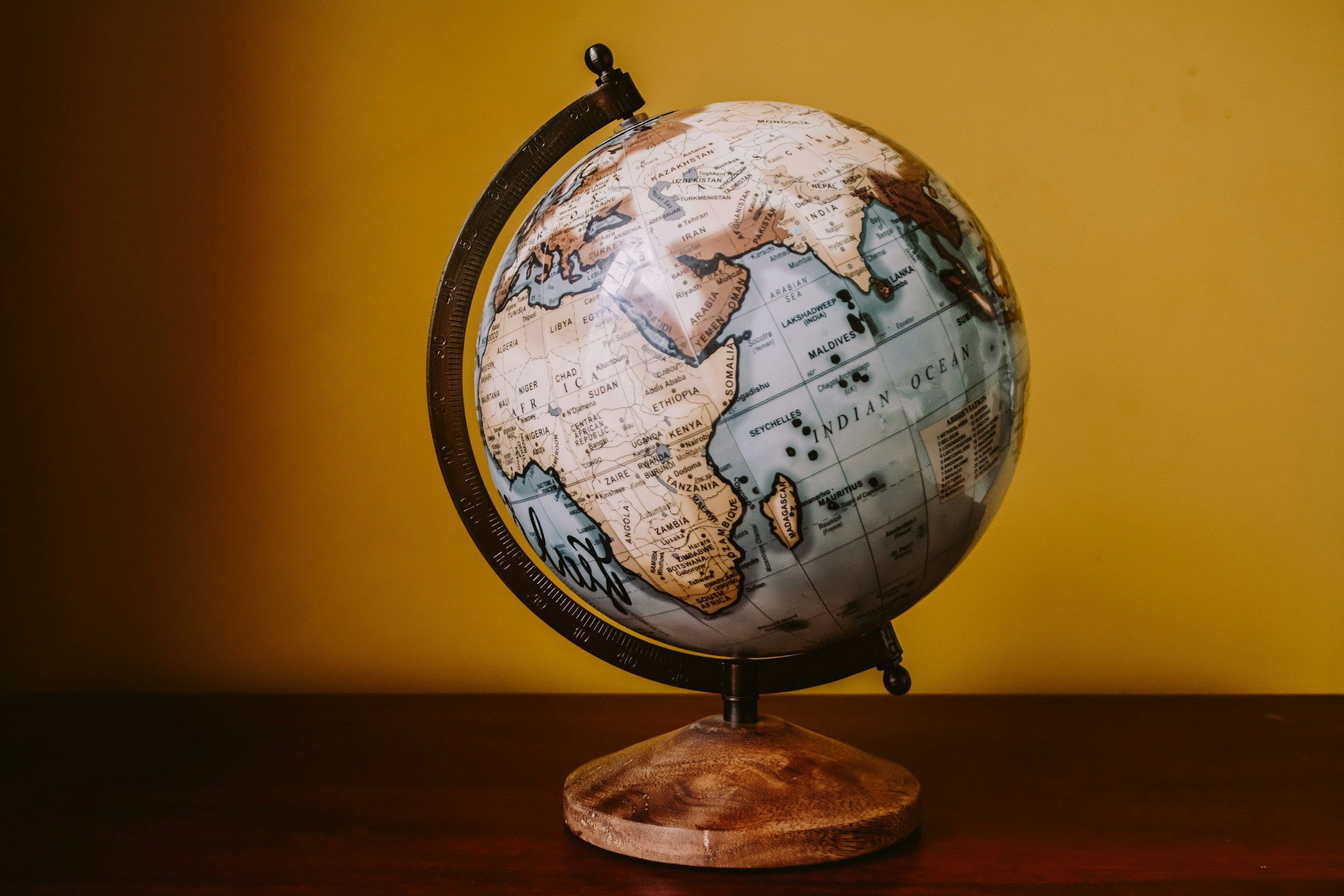 Antique globe on a desk in warm light